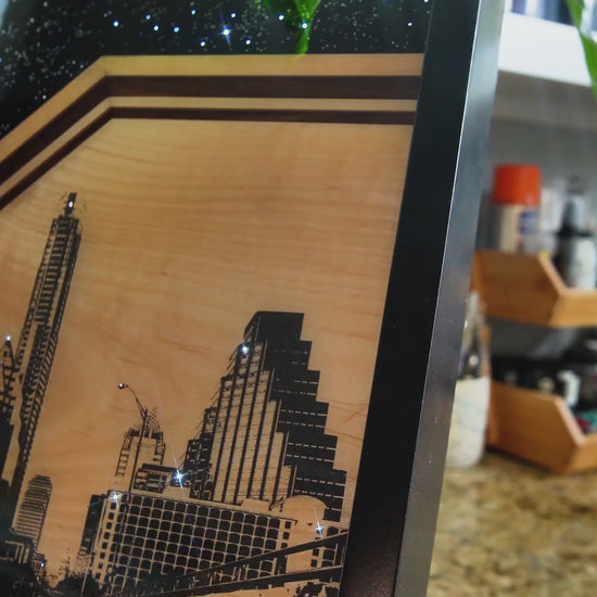City of Stars original mixed-media artwork by Ilene Listrom featuring the Austin skyline, fiber-optic lighting, resin, and architectural details.