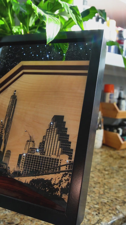City of Stars original mixed-media artwork by Ilene Listrom featuring the Austin skyline, fiber-optic lighting, resin, and architectural details.